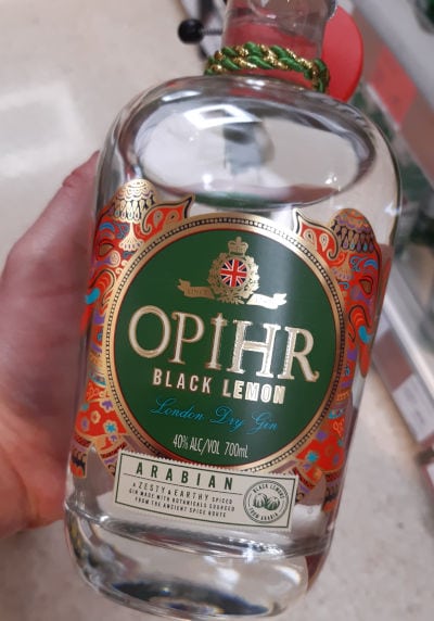 Andrew holding a bottle of Opihr Black Lemon Arabian Edition